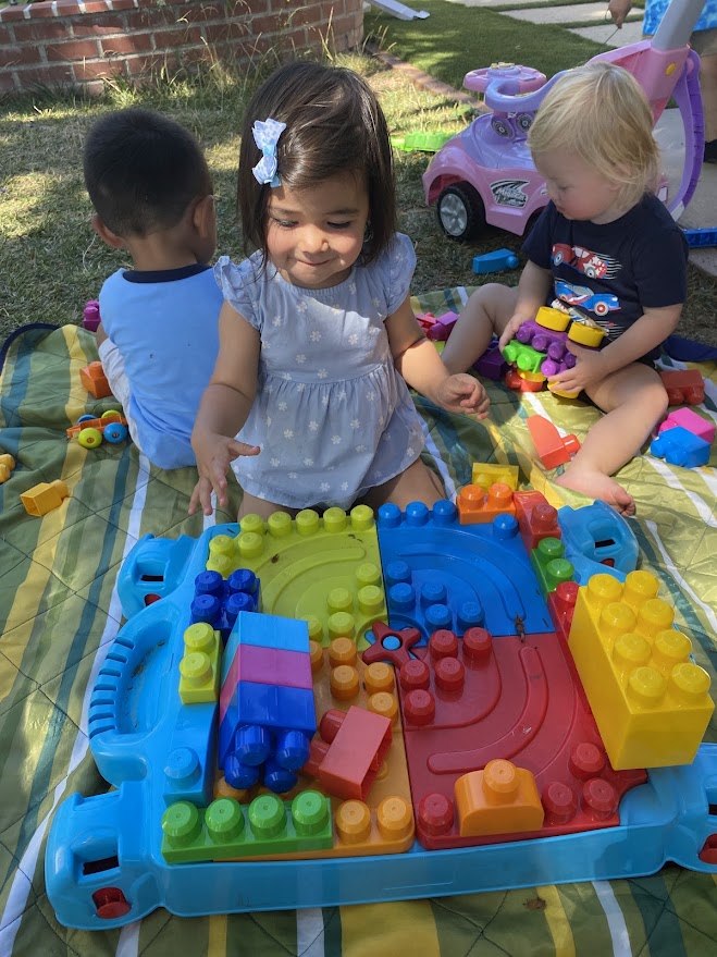 Children building together outdoors