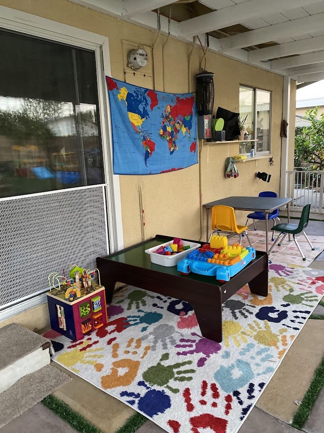 A welcoming outdoor learning space with children’s materials